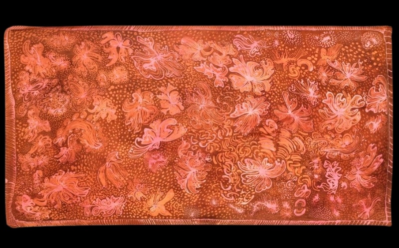 Emily Kame Kngwarreye’s Bush Tucker, c.1985, a silk batik with flowing pink, orange and cream organic forms, fine lines and clusters of dots across a rich reddish-brown ground.