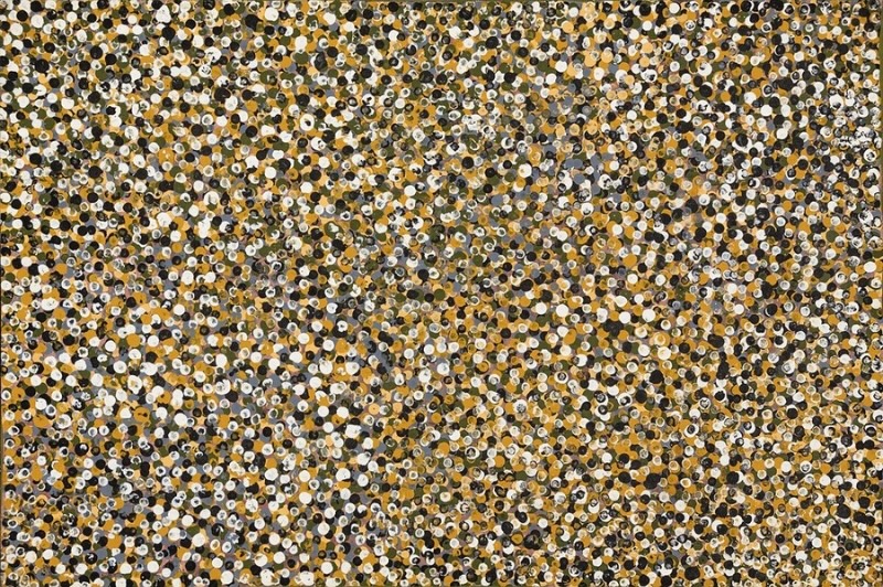 Emily Kame Kngwarreye’s My Anooralya Story, 1991, densely covered with overlapping white, black, ochre, yellow, grey and olive dots forming an all-over field.