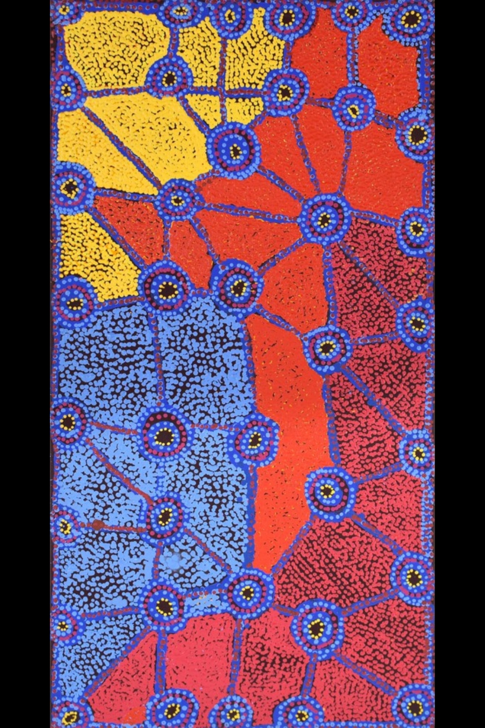 Tommy Mitchell's Ngatum Tingari Tjukurrpa (2007), depicting ancestral Tingari sites through blue concentric circles linked across red, yellow and blue dotted fields.