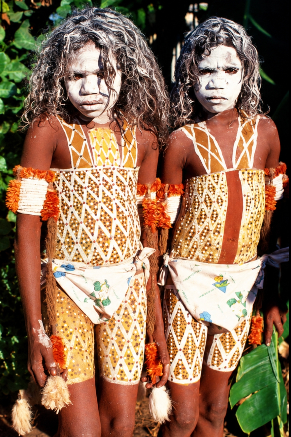 Yolŋu boys painted with aboriginal body painting designs or ancestral miny'tji designs for dhapi initiation at Yathalamarra, Arnhem Land