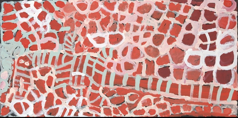 Harry Tjutjuna's Wati Ngintaka Tjukurpa, depicting the ancestral Perentie Lizard Man with an elongated striped body surrounded by red, pink and white circular patterns.